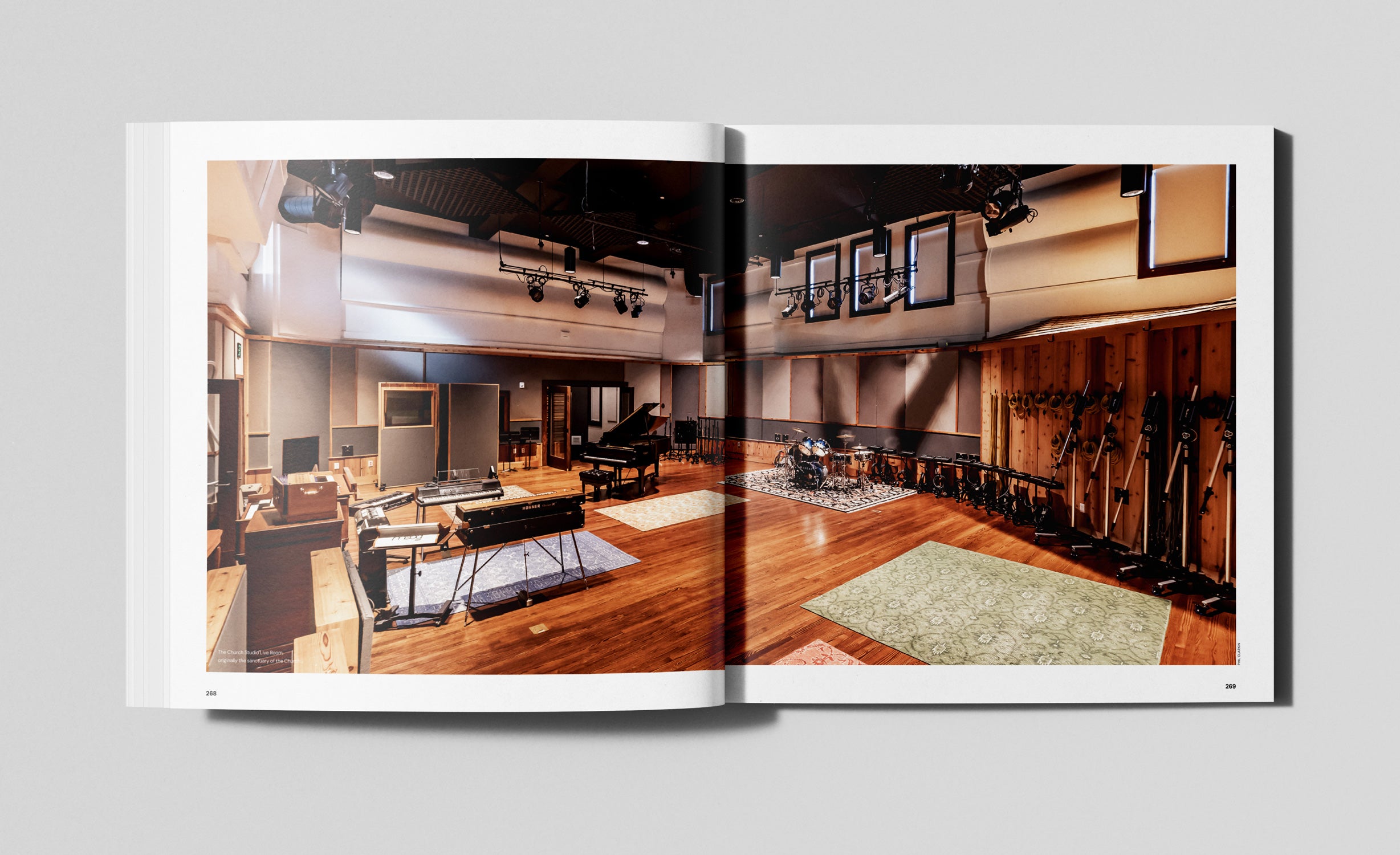 Open book showing a music studio with instruments and equipment.